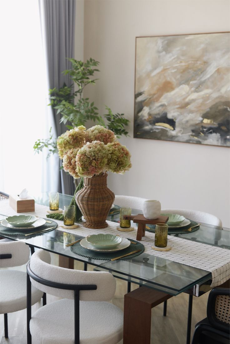 A calm dining table set with a simple plant-based bowl and a glass of water